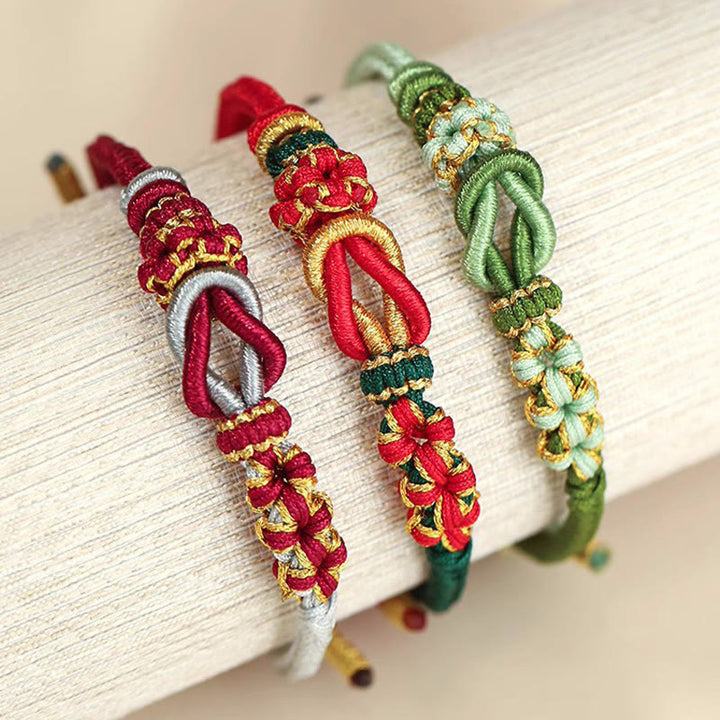 Bracelet de protection porte-bonheur fait main en Buddha Stones avec nœud en fleur de pêcher à huit fils