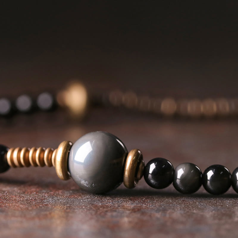 Bracelet multicouche positif en cuivre et bois d'ébène avec Buddha Stones arc-en-ciel obsidienne