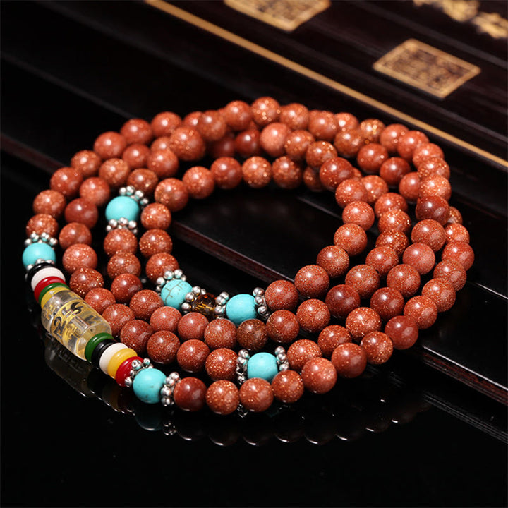 Bracelet de confiance avec 108 perles Mala en Buddha Stones Goldstone Om Mani Padme Hum Swastika