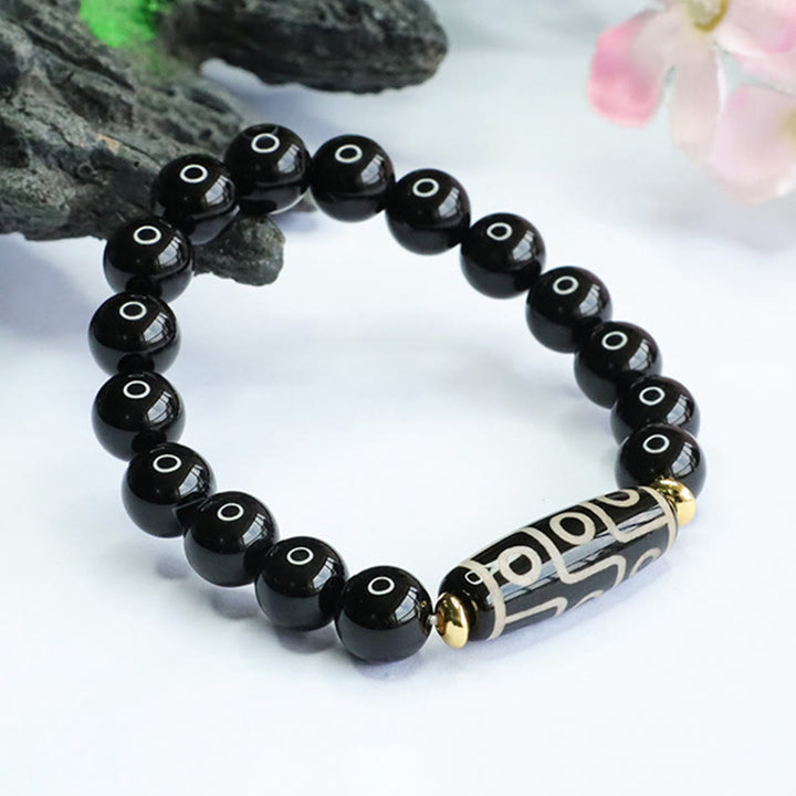 Bracelet de puissance tibétain en onyx noir avec perles dzi à neuf yeux et Buddha Stones