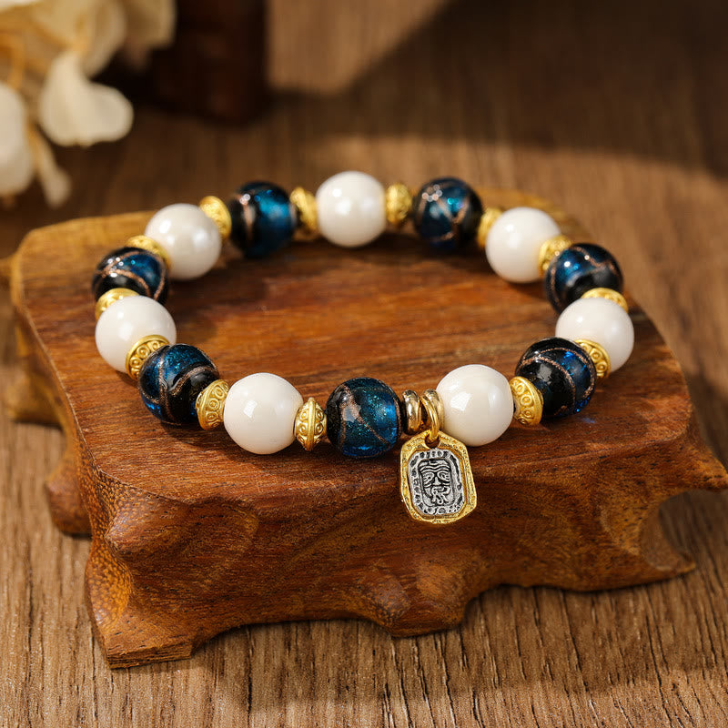 Bracelet de protection en perles de porcelaine en cendres et en verre Liuli avec breloque en Buddha Stones et déesse de la richesse tibétaine Zakiram