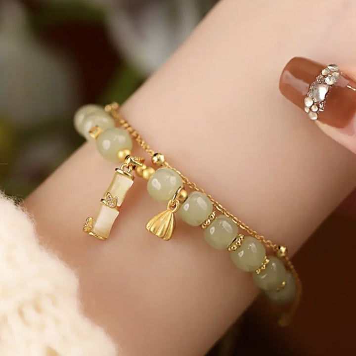 Bracelet à breloques en bambou et lotus en jade Hetian naturel avec Buddha Stones