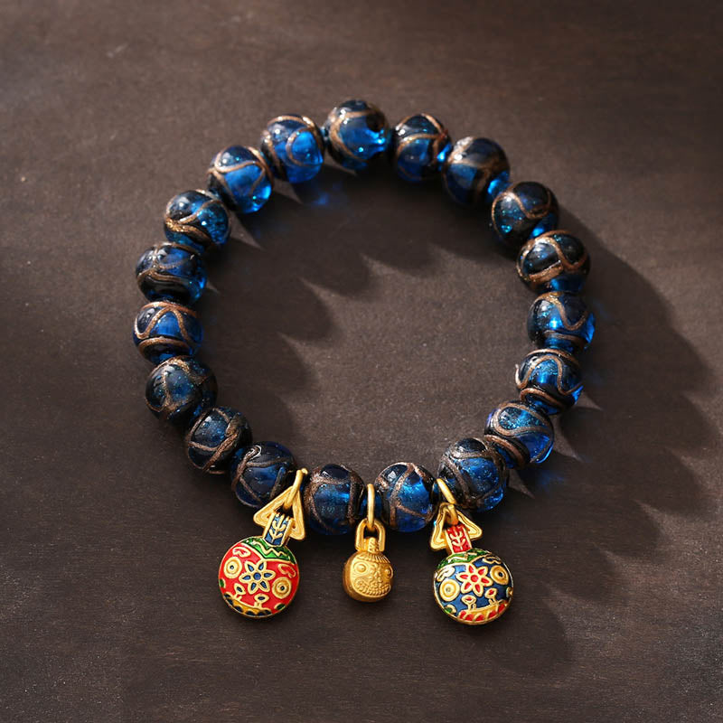 Bracelet porte-bonheur en perles de verre Liuli bleues avec Buddha Stones et bête avaleuse en or