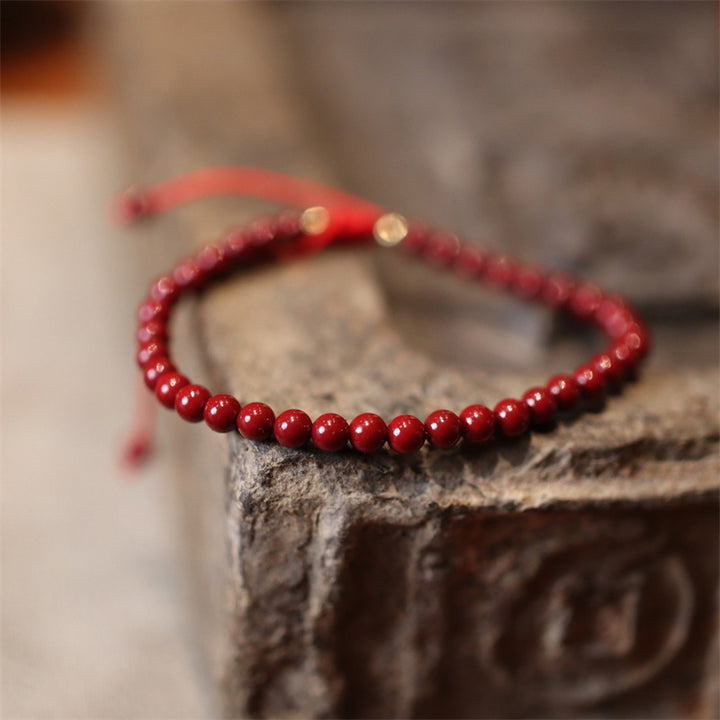 Bracelet de cheville tressé en fil rouge avec bénédiction en cinabre naturel et Buddha Stones
