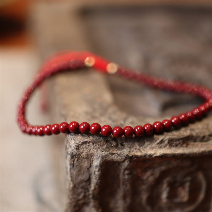 Bracelet de cheville tressé en fil rouge avec bénédiction en cinabre naturel et Buddha Stones
