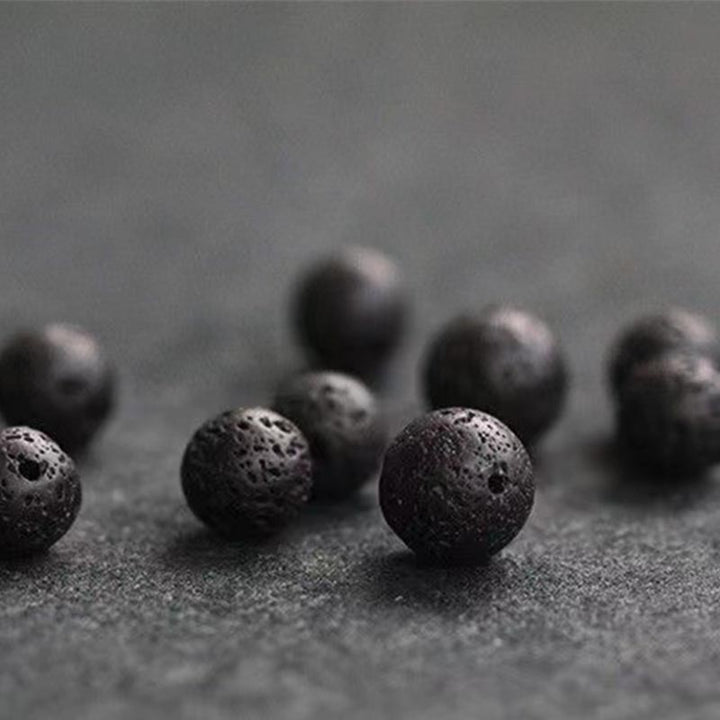 Bracelet de guérison en perles de pierre de lave et écailles de poisson en Buddha Stones