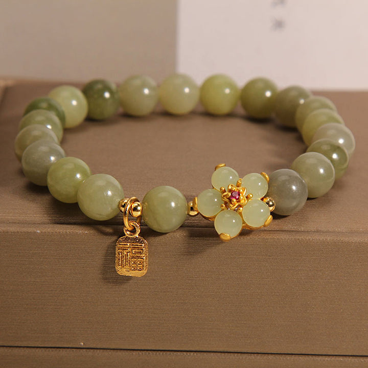 Bracelet porte-bonheur avec breloque en jade vert et fleur de Buddha Stones - Jade (tour de poignet 14-16 cm) - image 0