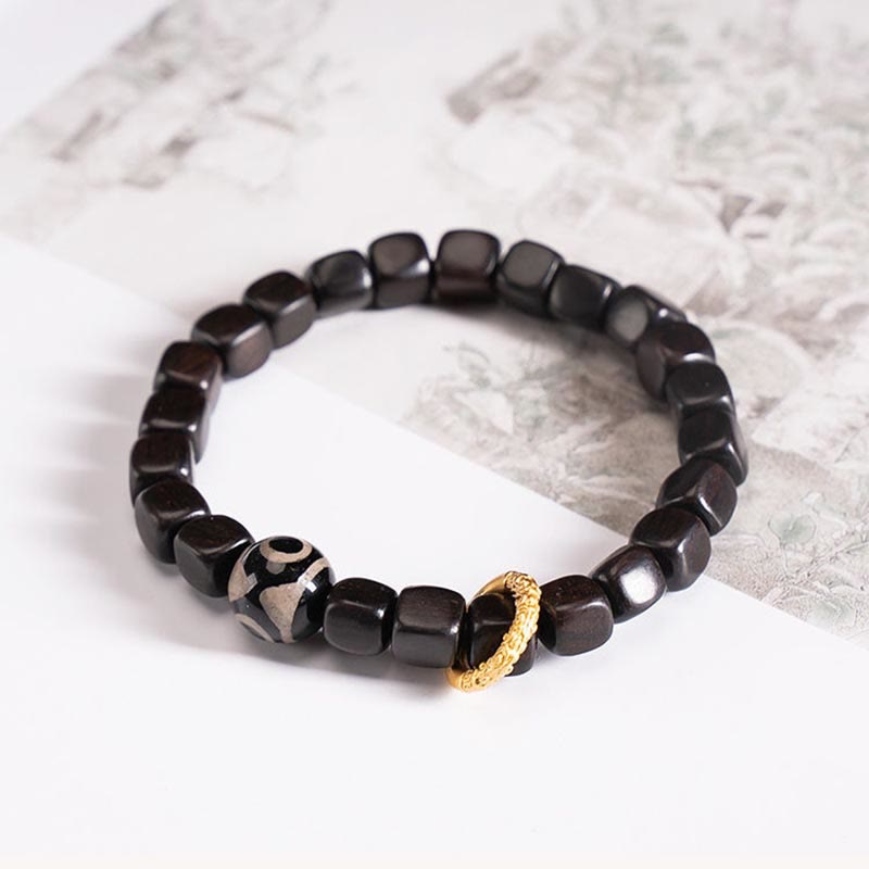 Bracelet de perles dzi en bois d'ébène tibétain avec Buddha Stones et calme