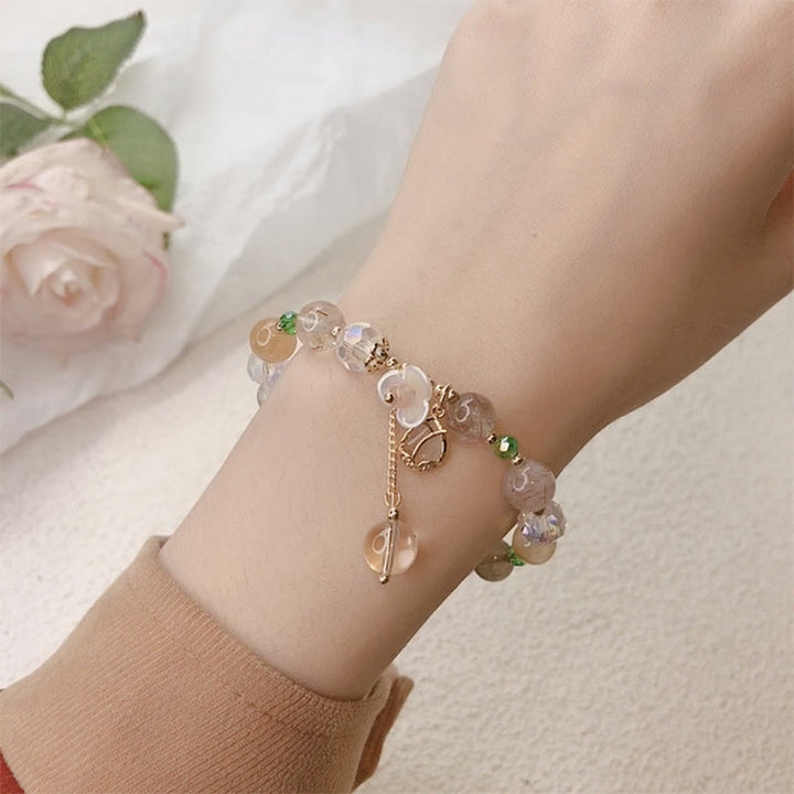 Bracelet de guérison en quartz fraise, quartz rutile, fluorite et fleur de lotus Buddha Stones