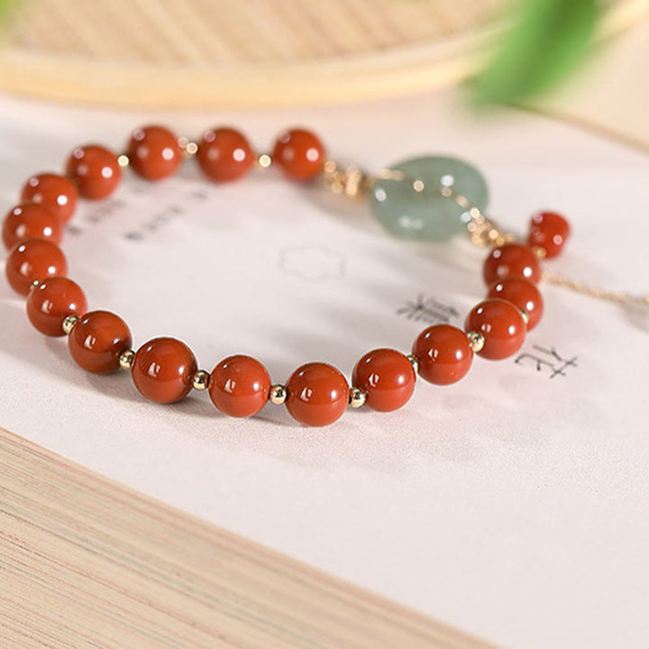 Bracelet de confiance en forme de gourde en cuivre avec boucle de paix en jade et agate rouge rempli d'or 14 carats de Buddha Stones