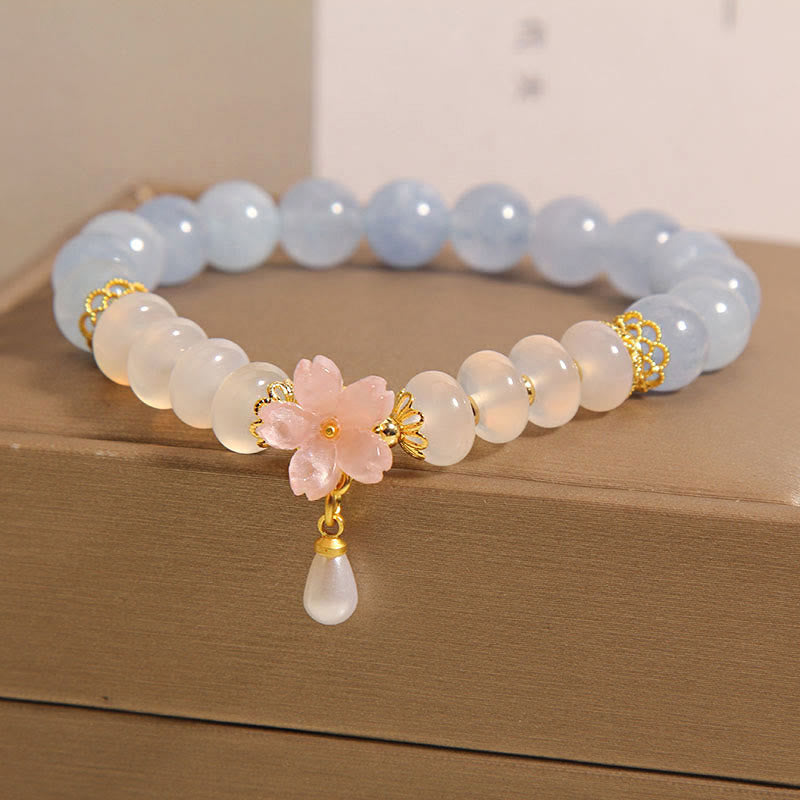 Bracelet de guérison en forme de fleur avec perles d'agate blanche et aigue-marine en Buddha Stones