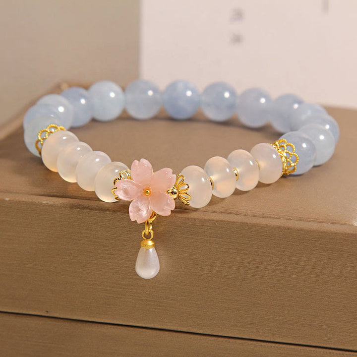 Bracelet de guérison en forme de fleur avec perles d'agate blanche et aigue-marine en Buddha Stones