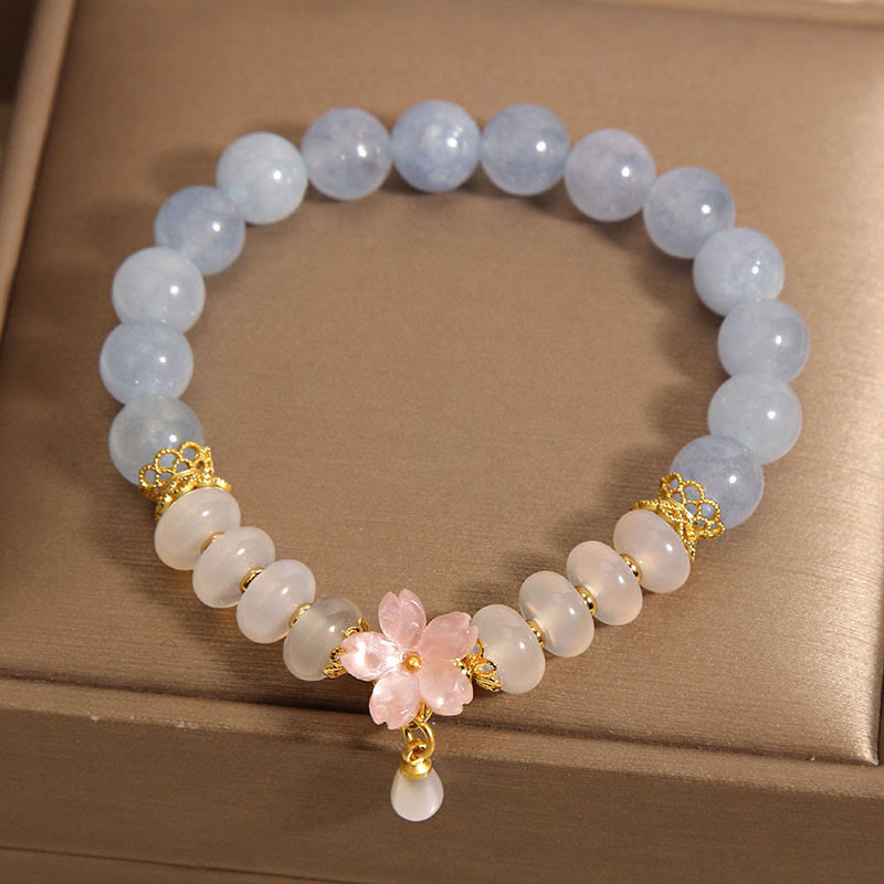 Bracelet de guérison en forme de fleur avec perles d'agate blanche et aigue-marine en Buddha Stones