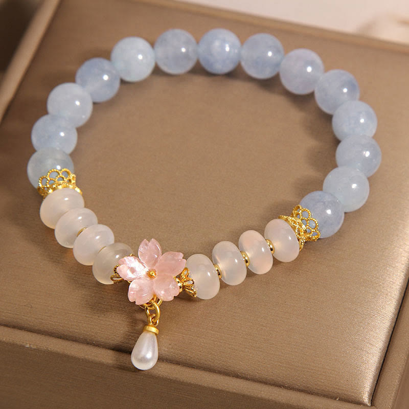 Bracelet de guérison en forme de fleur avec perles d'agate blanche et aigue-marine en Buddha Stones