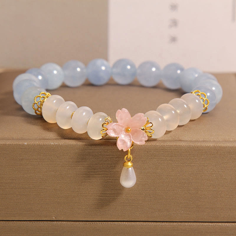 Bracelet de guérison en forme de fleur avec perles d'agate blanche et aigue-marine en Buddha Stones