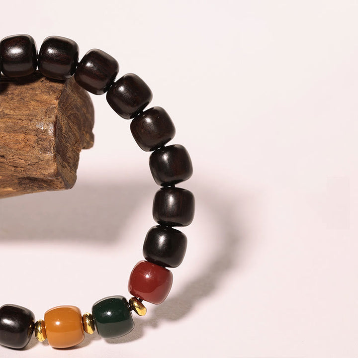Bracelet d'équilibre et de paix en bois d'ébène et bois de rose Buddha Stones