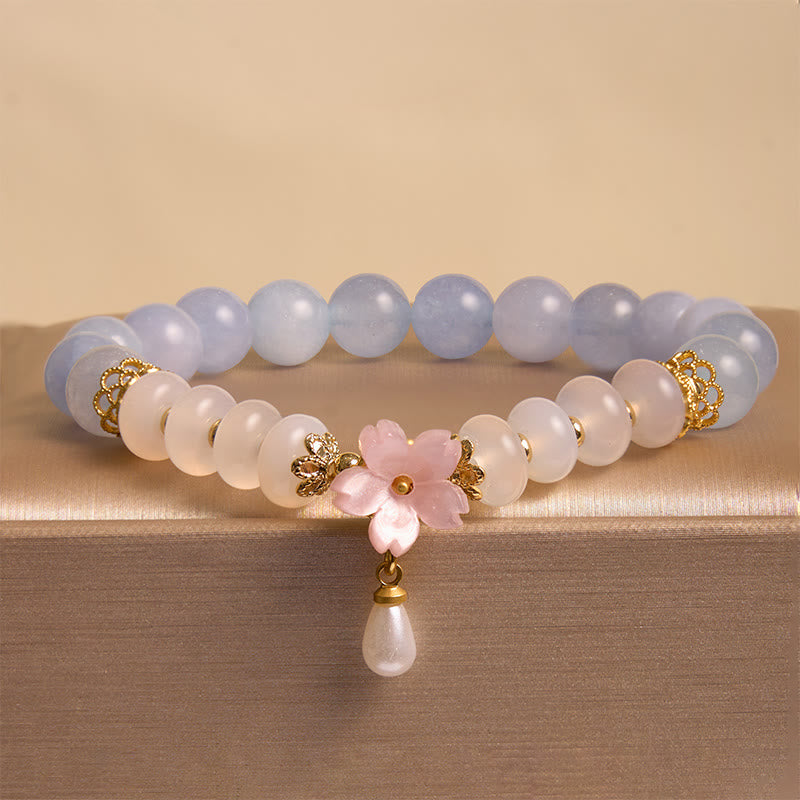Bracelet de guérison en forme de fleur avec perles d'agate blanche et aigue-marine en Buddha Stones