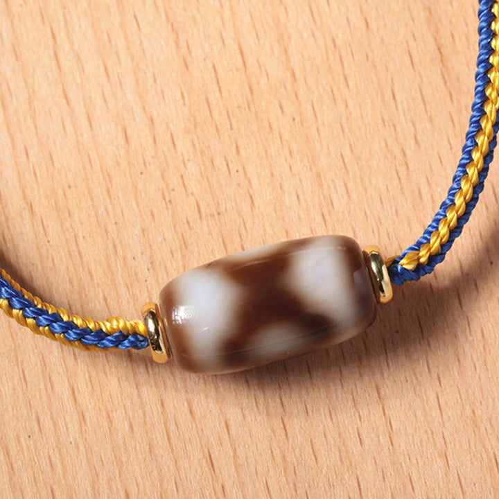 Bracelet tibétain en perles dzi à trois yeux avec Buddha Stones