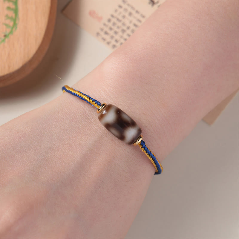 Bracelet tibétain en perles dzi à trois yeux avec Buddha Stones