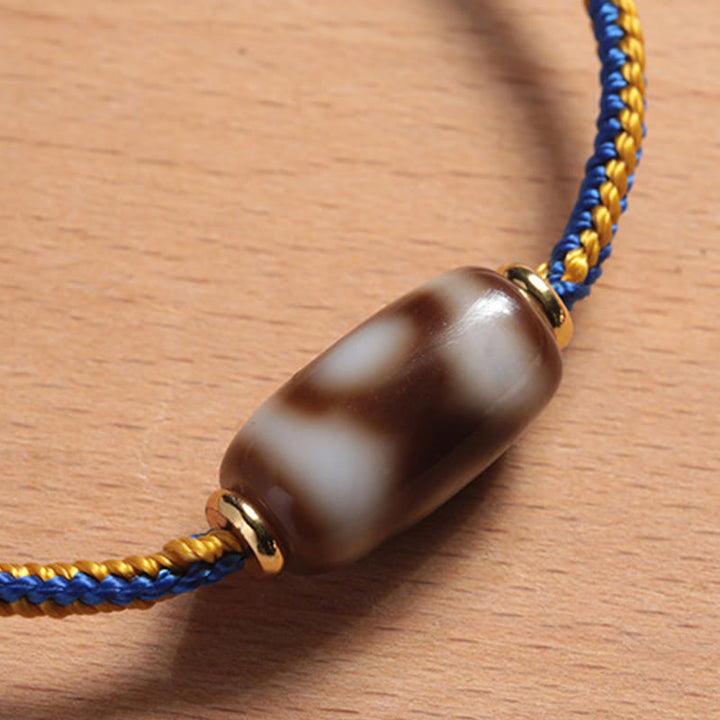 Bracelet tibétain en perles dzi à trois yeux avec Buddha Stones