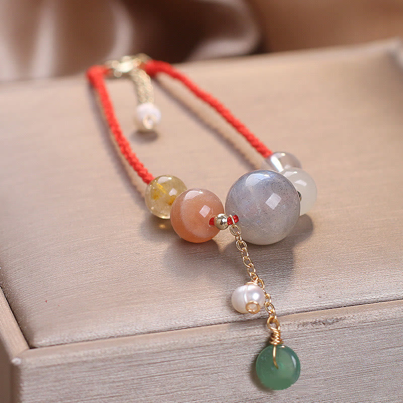 Bracelet de guérison avec breloque en pierre de lune et pierre de soleil et Buddha Stones