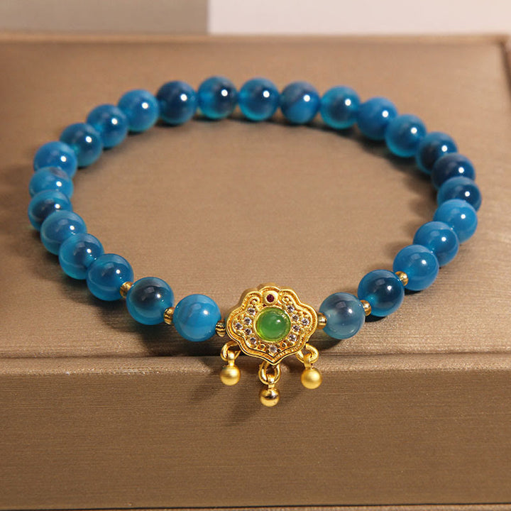 Bracelet de guérison à breloques en agate bleue Buddha Stones