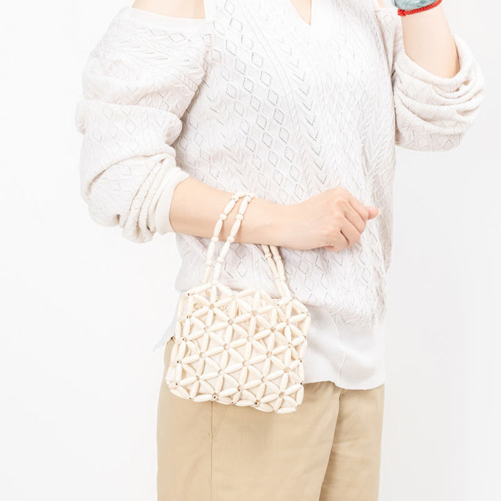 Sac à main en mini perles en bois tissées à la main Buddha Stones