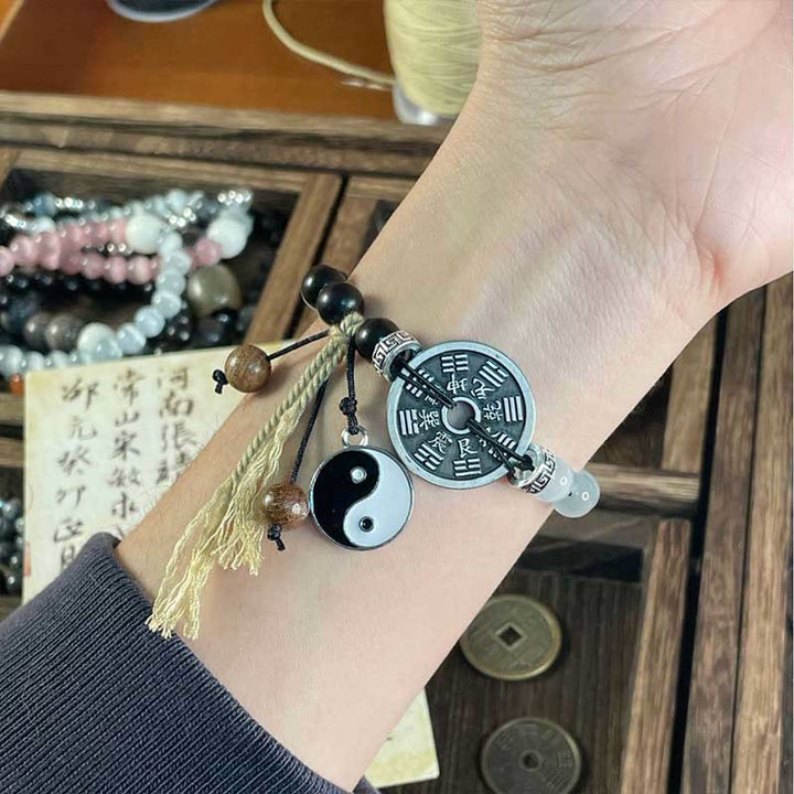 Bracelet de corde de support de pièce de monnaie Yin Yang Bagua en bois d'ébène et œil de chat en Buddha Stones