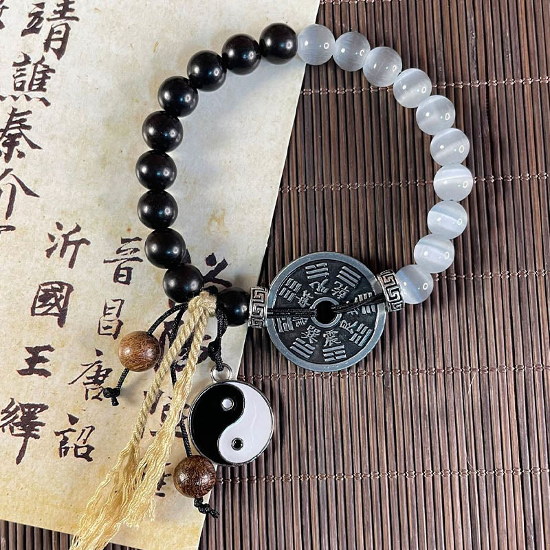 Bracelet de corde de support de pièce de monnaie Yin Yang Bagua en bois d'ébène et œil de chat en Buddha Stones