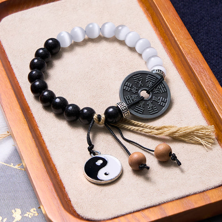 Bracelet de corde de support de pièce de monnaie Yin Yang Bagua en bois d'ébène et œil de chat en Buddha Stones