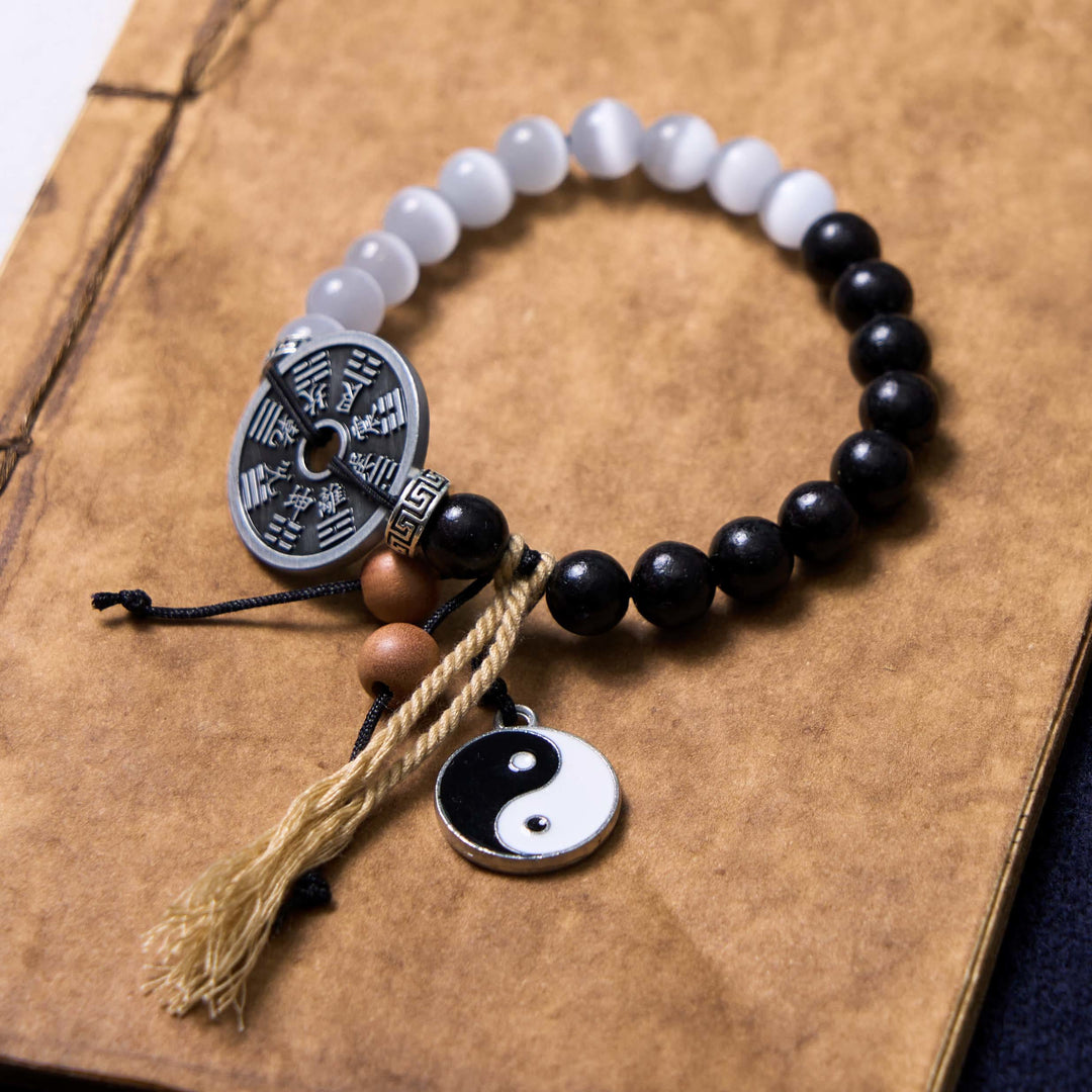 Bracelet de corde de support de pièce de monnaie Yin Yang Bagua en bois d'ébène et œil de chat en Buddha Stones