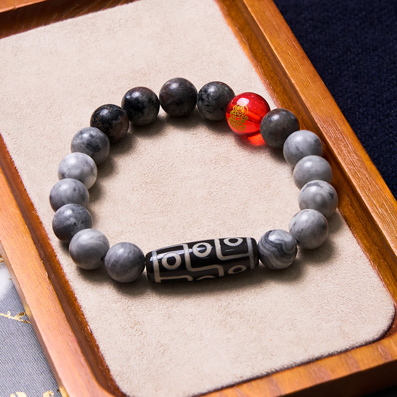 Bracelet tibétain à neuf yeux en perles dzi et jaspe Picasso avec Buddha Stones