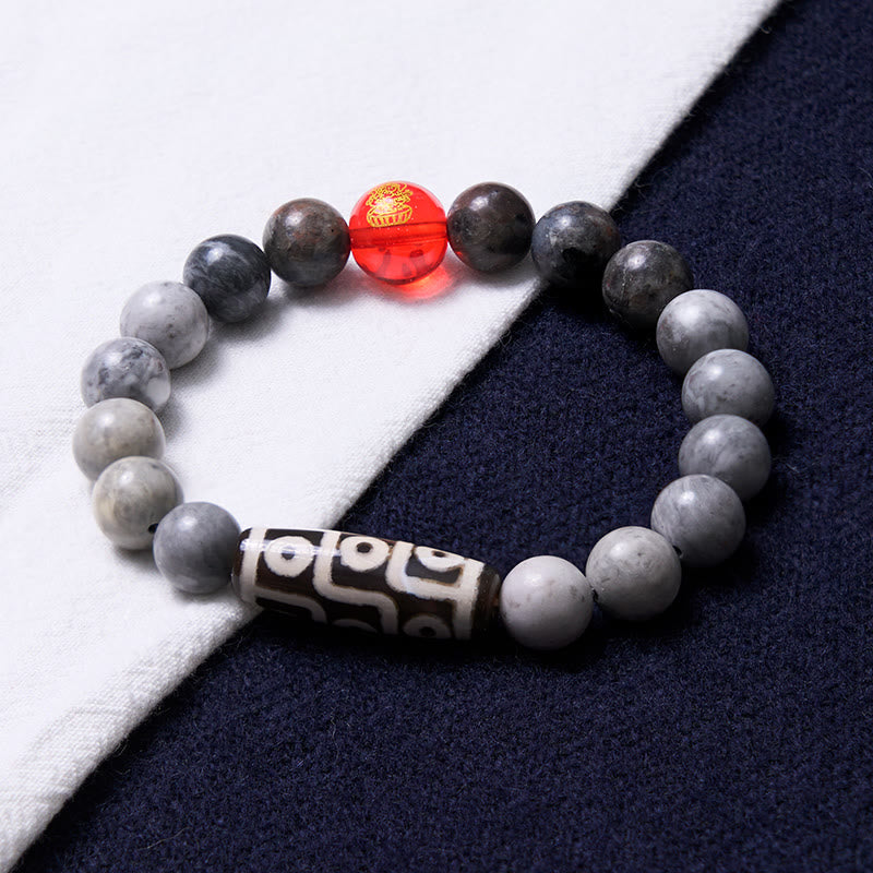 Bracelet tibétain à neuf yeux en perles dzi et jaspe Picasso avec Buddha Stones