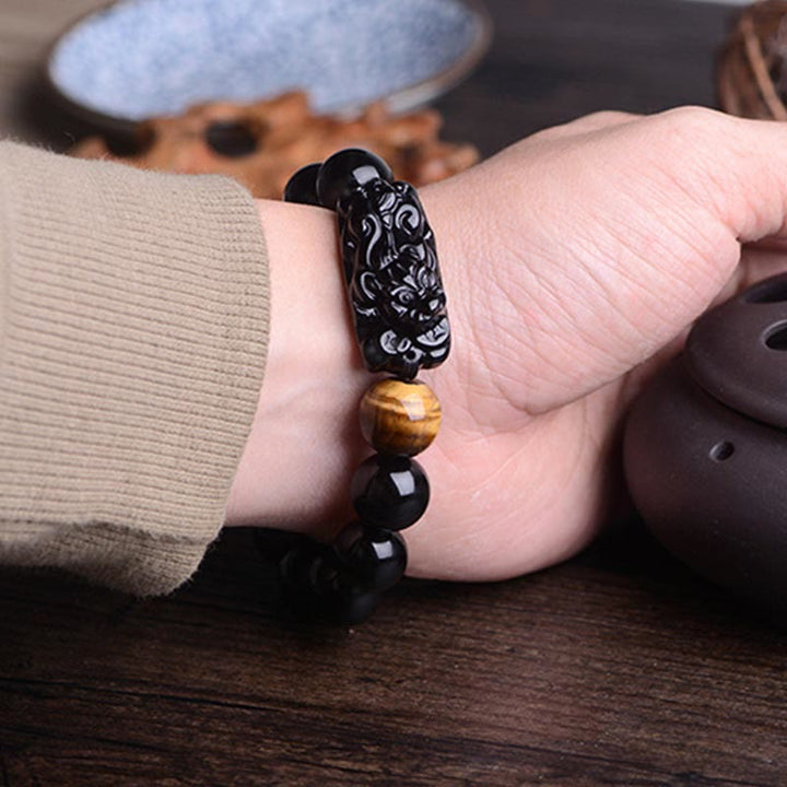 Bracelet de force en obsidienne noire naturelle PiXiu œil de tigre de Buddha Stones