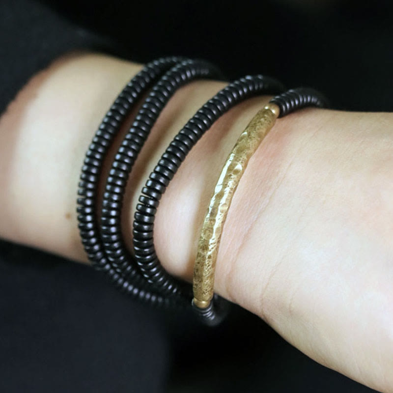 Bracelet multicouche en cuivre avec perles en bois d'ébène tibétain et Buddha Stones