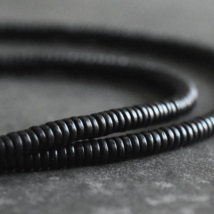 Bracelet multicouche en cuivre avec perles en bois d'ébène tibétain et Buddha Stones