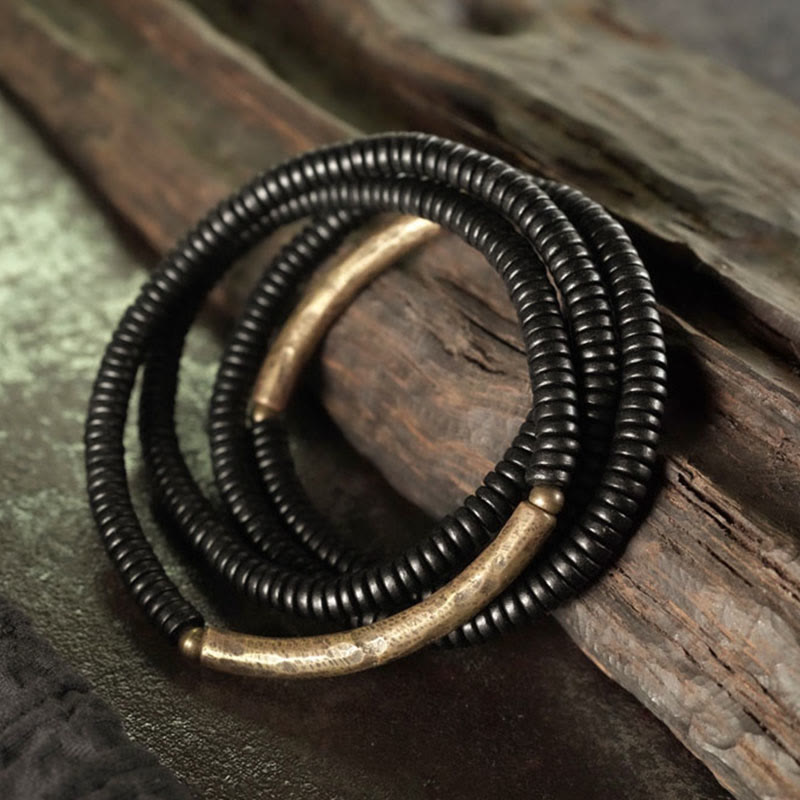 Bracelet multicouche en cuivre avec perles en bois d'ébène tibétain et Buddha Stones