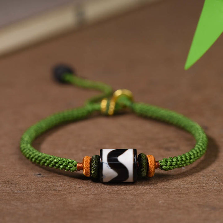 Bracelet de protection en corde verte tressée en perles dzi tibétaines faites à la main avec Buddha Stones