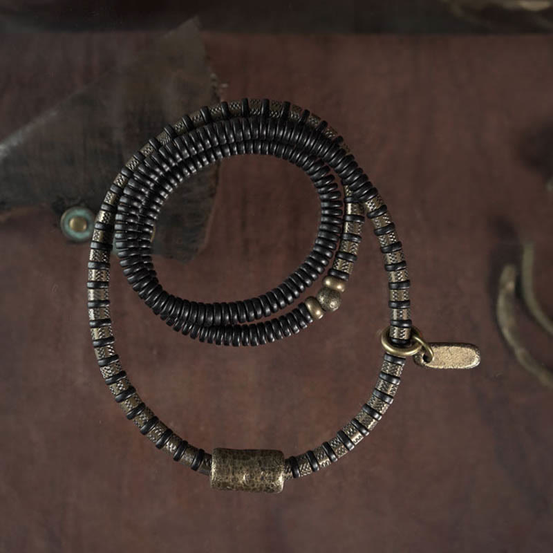 Bracelet multicouche en cuivre et perles en bois d'ébène tibétain avec Buddha Stones