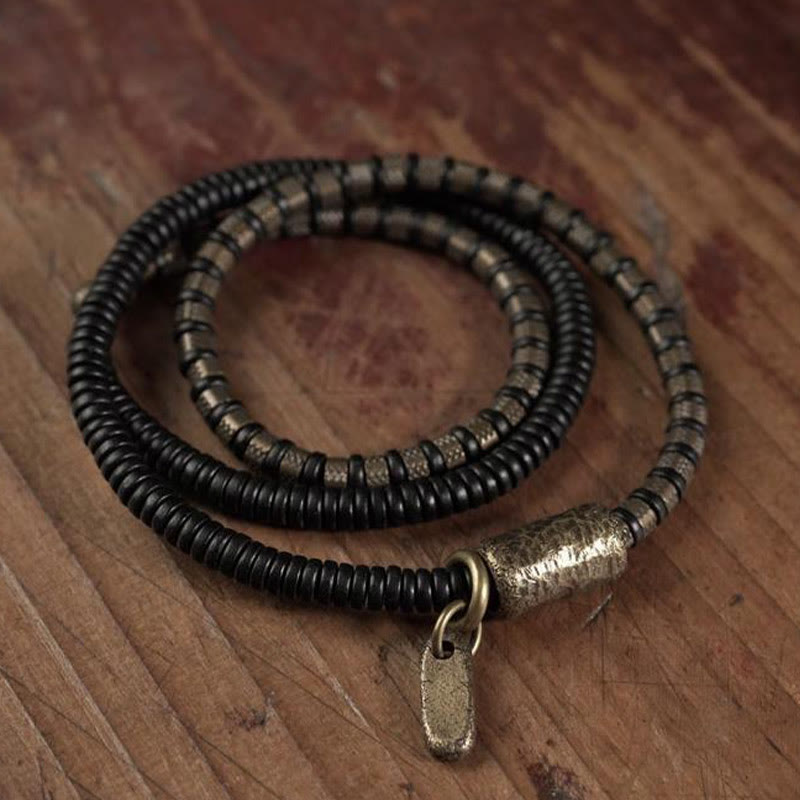 Bracelet multicouche en cuivre et perles en bois d'ébène tibétain avec Buddha Stones