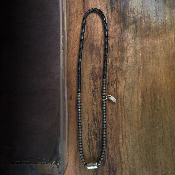 Bracelet multicouche en cuivre et perles en bois d'ébène tibétain avec Buddha Stones