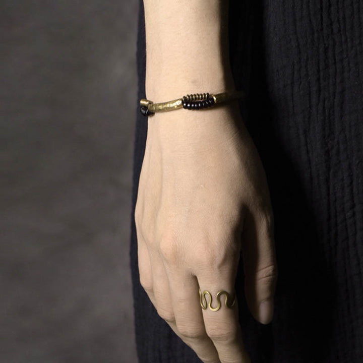 Bracelet fait main en Buddha Stones vintage en bois d'ébène et cuivre pour la chance et la richesse
