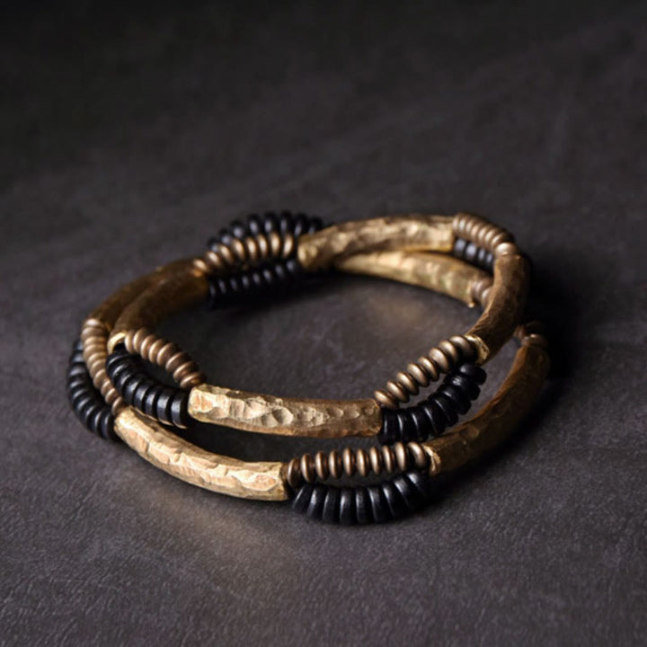 Bracelet fait main en Buddha Stones vintage en bois d'ébène et cuivre pour la chance et la richesse
