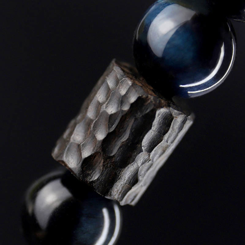 Bracelet calme en perles de bois d'ébène et œil de tigre avec Buddha Stones