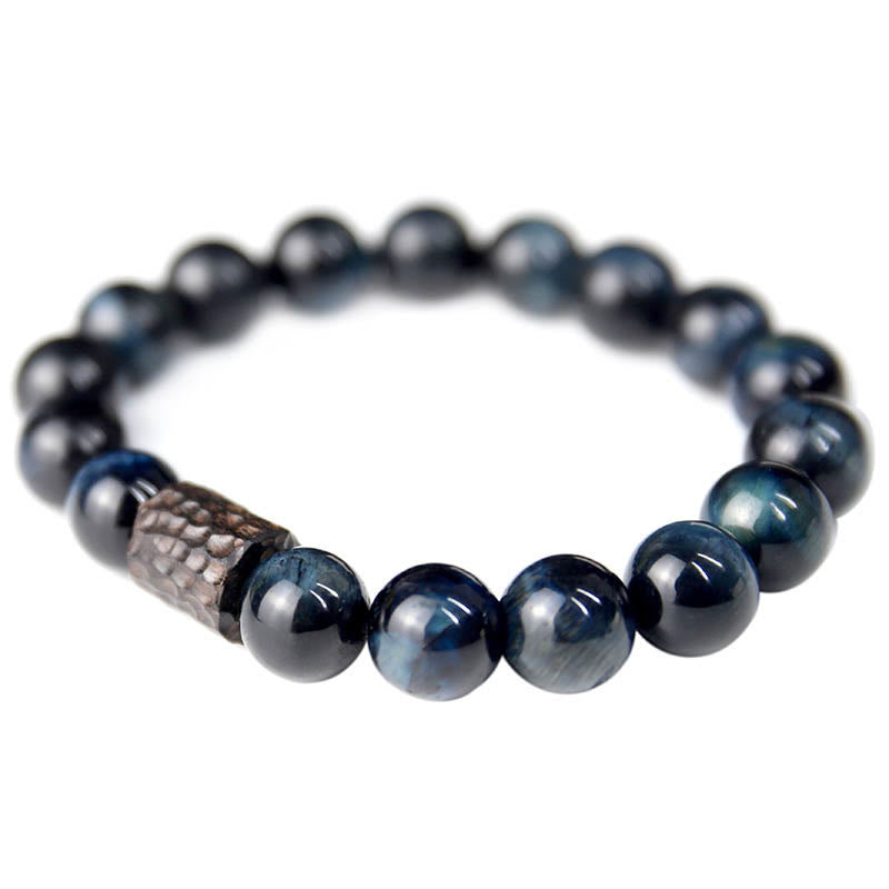 Bracelet calme en perles de bois d'ébène et œil de tigre avec Buddha Stones