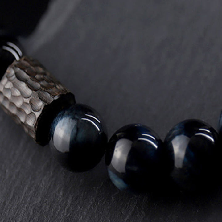 Bracelet calme en perles de bois d'ébène et œil de tigre avec Buddha Stones