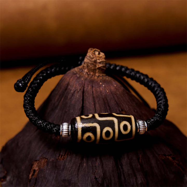 Bracelet en corde de protection de richesse Buddha Stones tibétaines à neuf yeux et à trois yeux