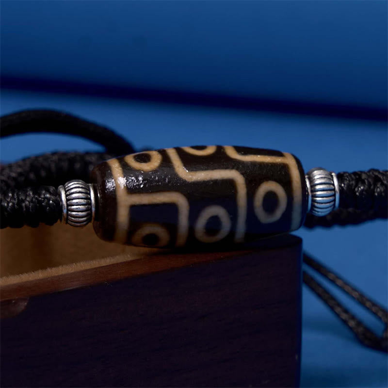 Bracelet en corde de protection de richesse Buddha Stones tibétaines à neuf yeux et à trois yeux