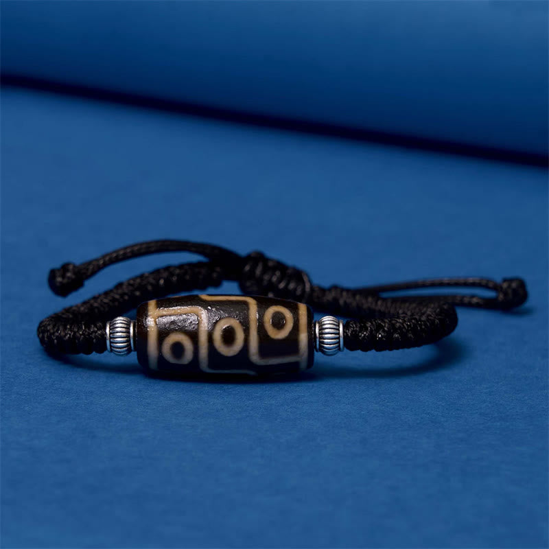 Bracelet en corde de protection de richesse Buddha Stones tibétaines à neuf yeux et à trois yeux