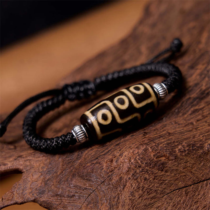 Bracelet en corde de protection de richesse Buddha Stones tibétaines à neuf yeux et à trois yeux